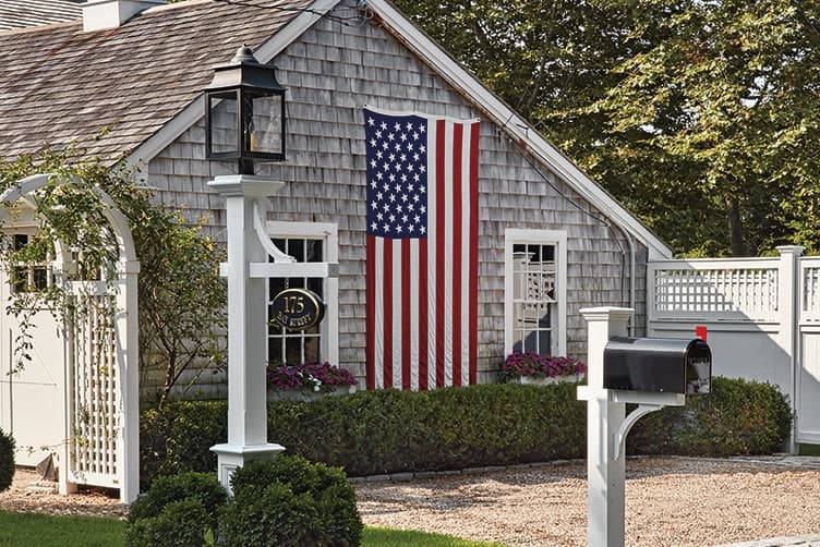 a lantern post in front of a house