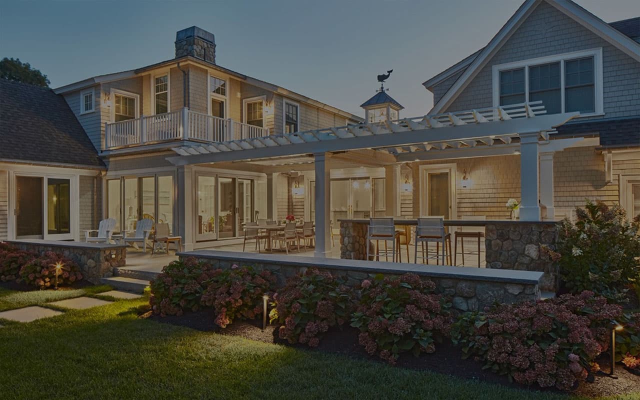 a pergola with an outdoor fireplace in a yard